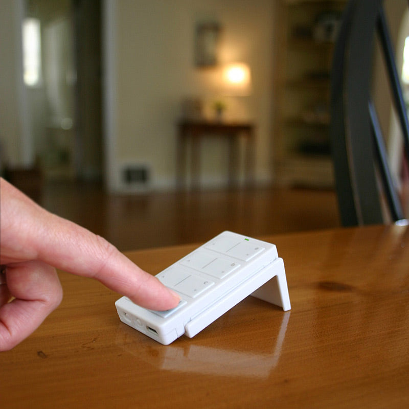 Visor Clip and Tabletop Stand for Mini Remote on table top